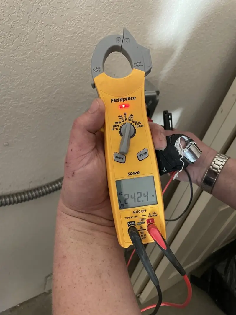 Voltage testing with clamp meter during Ceiling Fan Installation in Blakely
